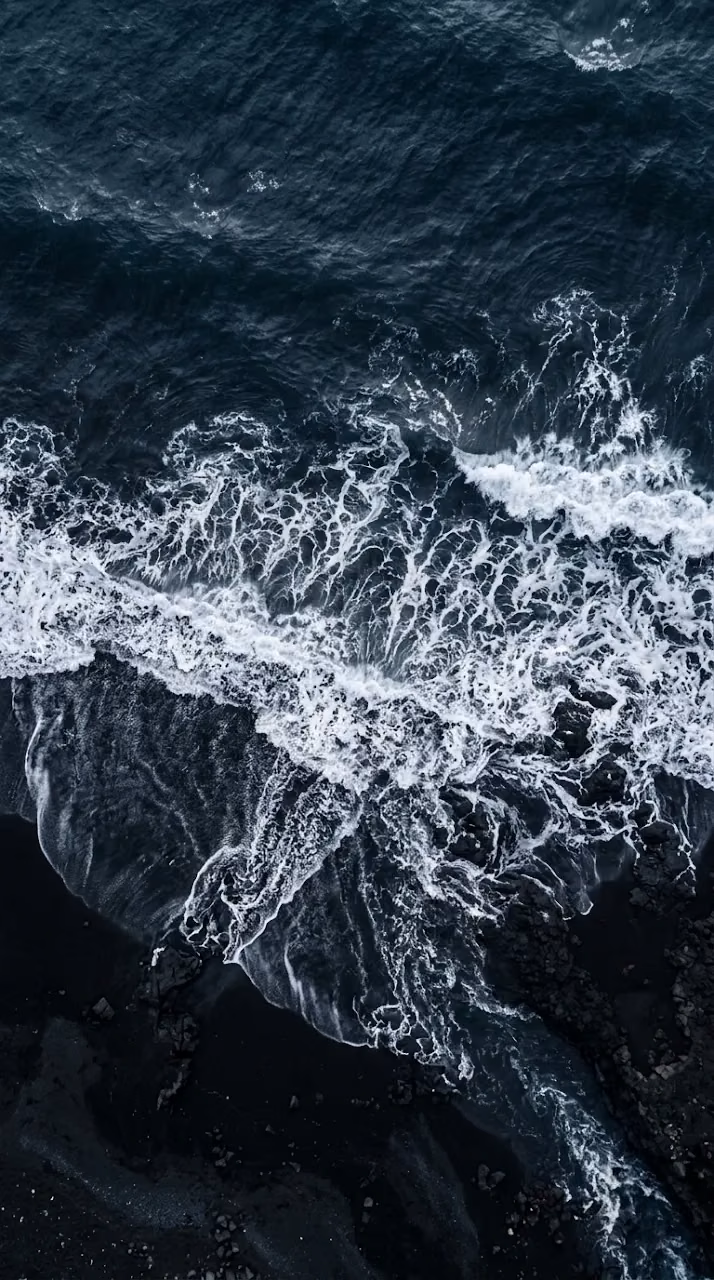 Aerial Drone Photography of Dark Blue Sea and Foaming White Waves - Free Mobile AMOLED Wallpaper Background