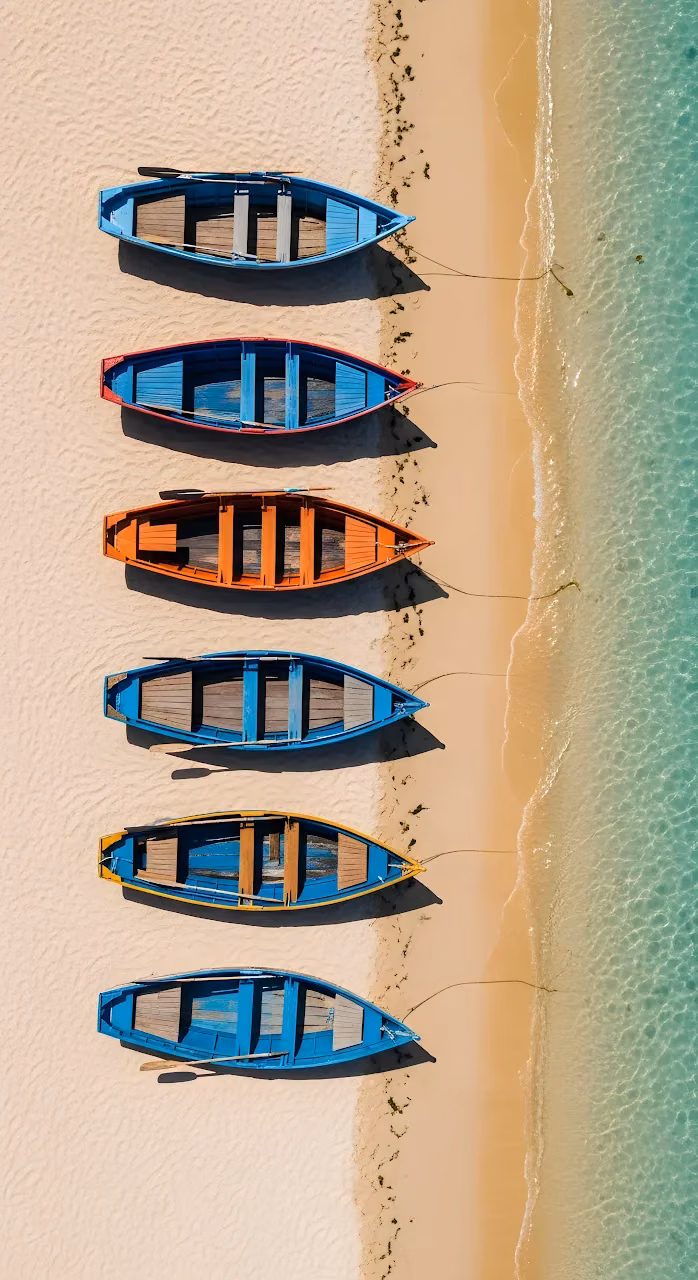 Aerial View of Colorful Fishing Boats Lined on Sandy Beach - Free Mobile AMOLED Wallpaper Background