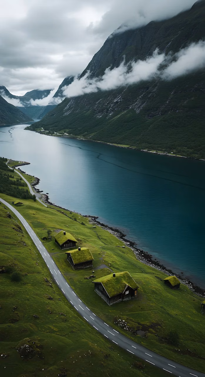 Aerial View of Grass Roof Houses along a Norwegian Fjord - Free Mobile AMOLED Wallpaper Background