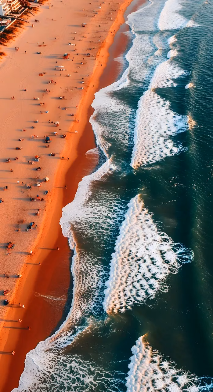 Download Aerial View Ocean Waves Crashing Golden Hour Beach Shoreline Wallpaper in Mobile HD Aerial View Ocean Waves Crashing Golden Hour Beach Shoreline - Free Mobile AMOLED Wallpaper Background