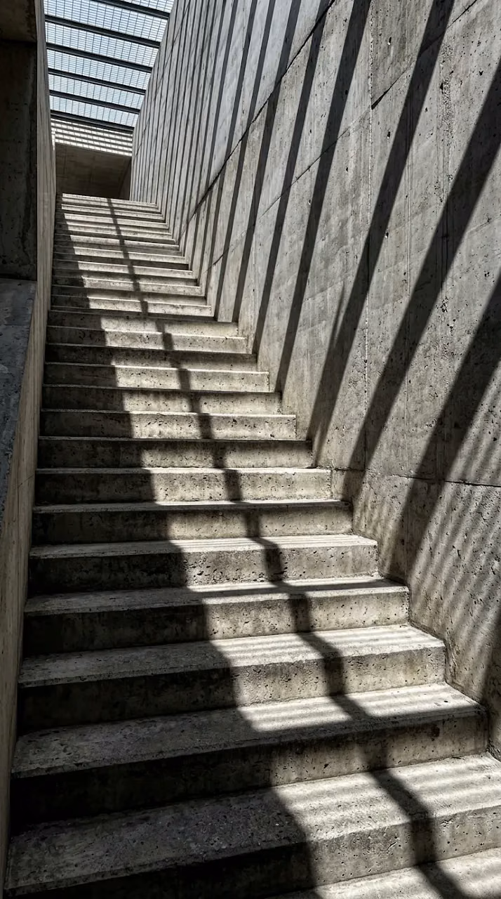 Architectural Concrete Stairs with High-Contrast Light and Shadow - Free Mobile AMOLED Wallpaper Background