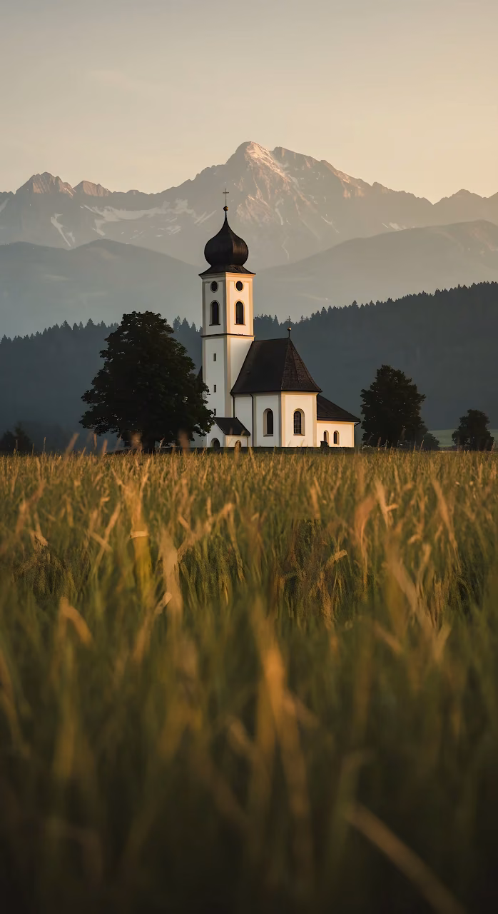 Bavarian Church in Golden Field with Alpine Mountains - Free Mobile AMOLED Wallpaper Background
