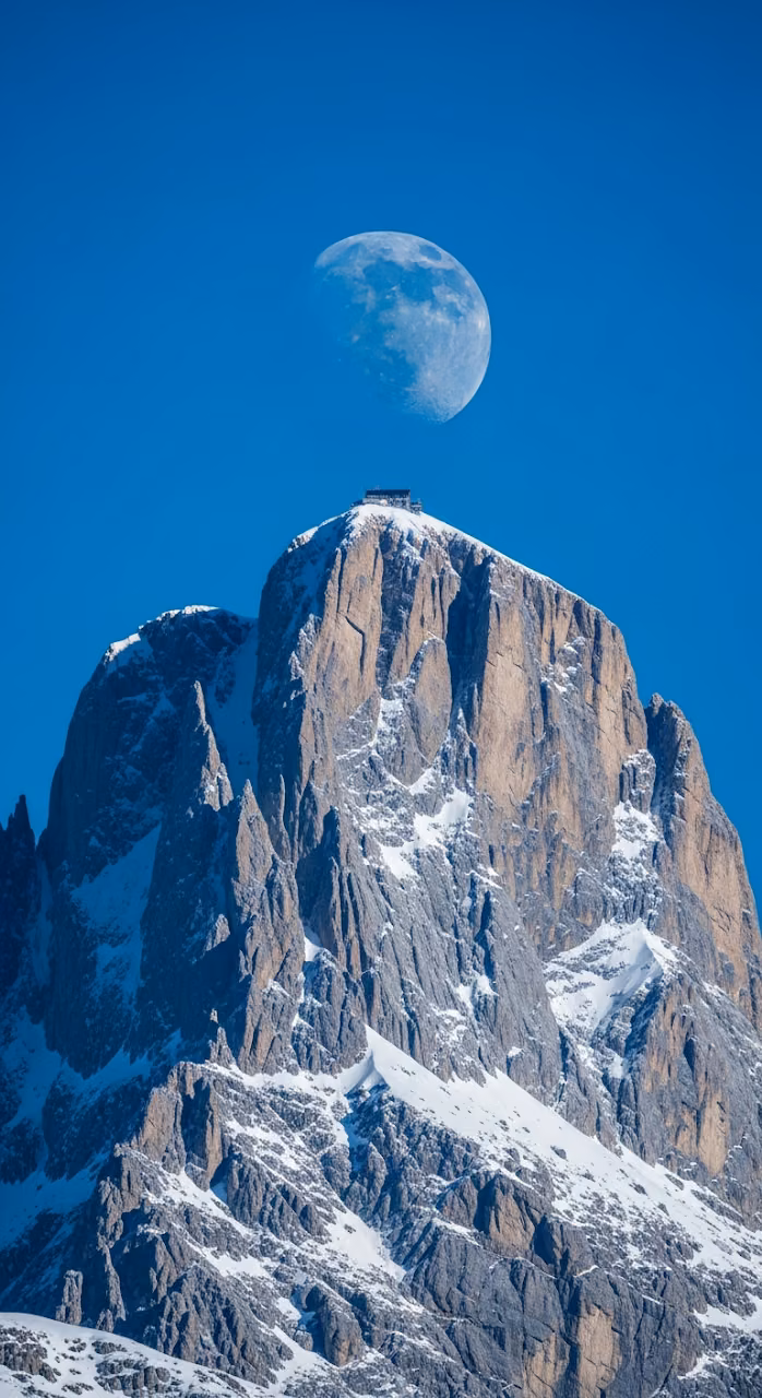 Download Bright Telephoto View of Rugged Snowy Alpine Peak with Pale Blue Moon Wallpaper in Mobile HD Bright Telephoto View of Rugged Snowy Alpine Peak with Pale Blue Moon - Free Mobile AMOLED Wallpaper Background