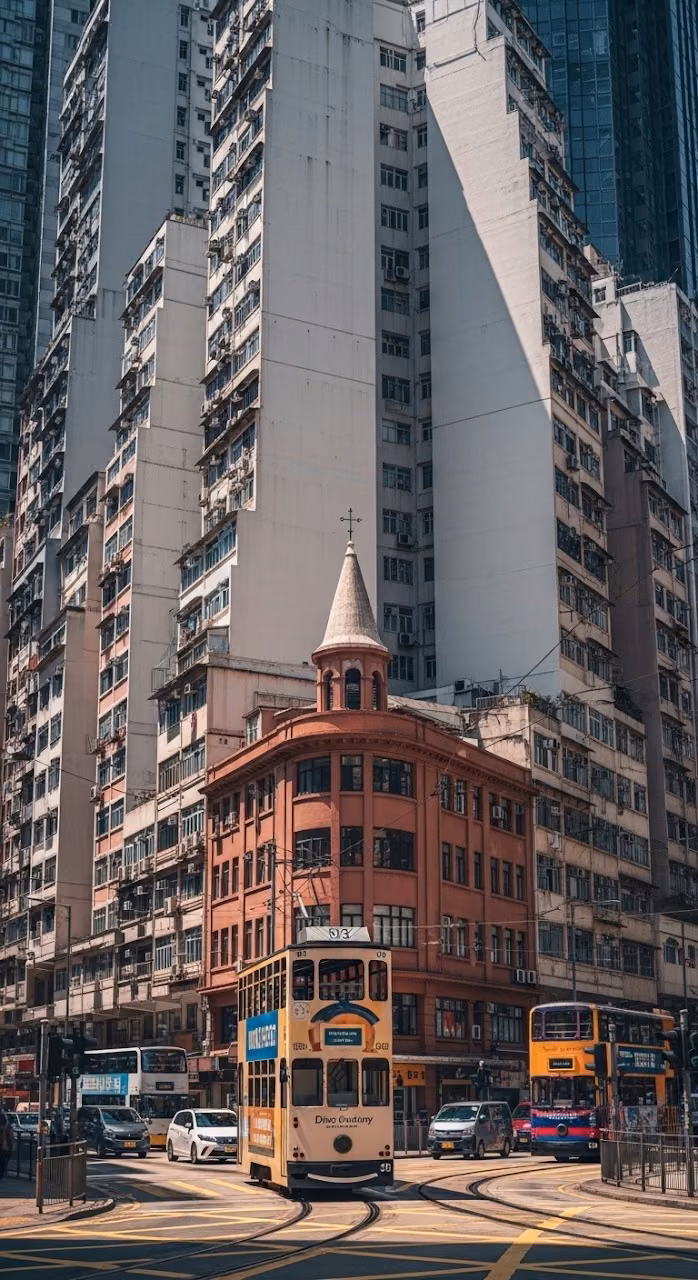 Busy Hong Kong Street Scene with Trams and Tall Buildings in Mid-day Sun - Free Mobile AMOLED Wallpaper Background