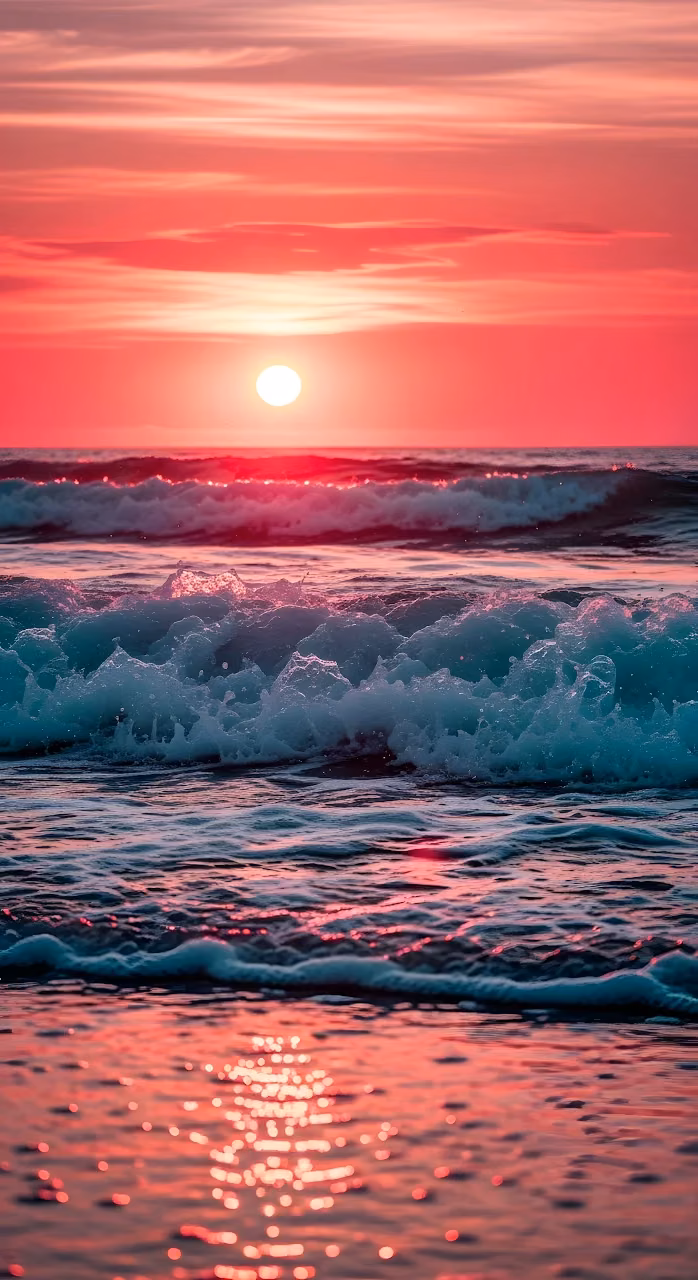 Crimson Sunset Over Crashing Ocean Waves and Sea Foam - Free Mobile AMOLED Wallpaper Background