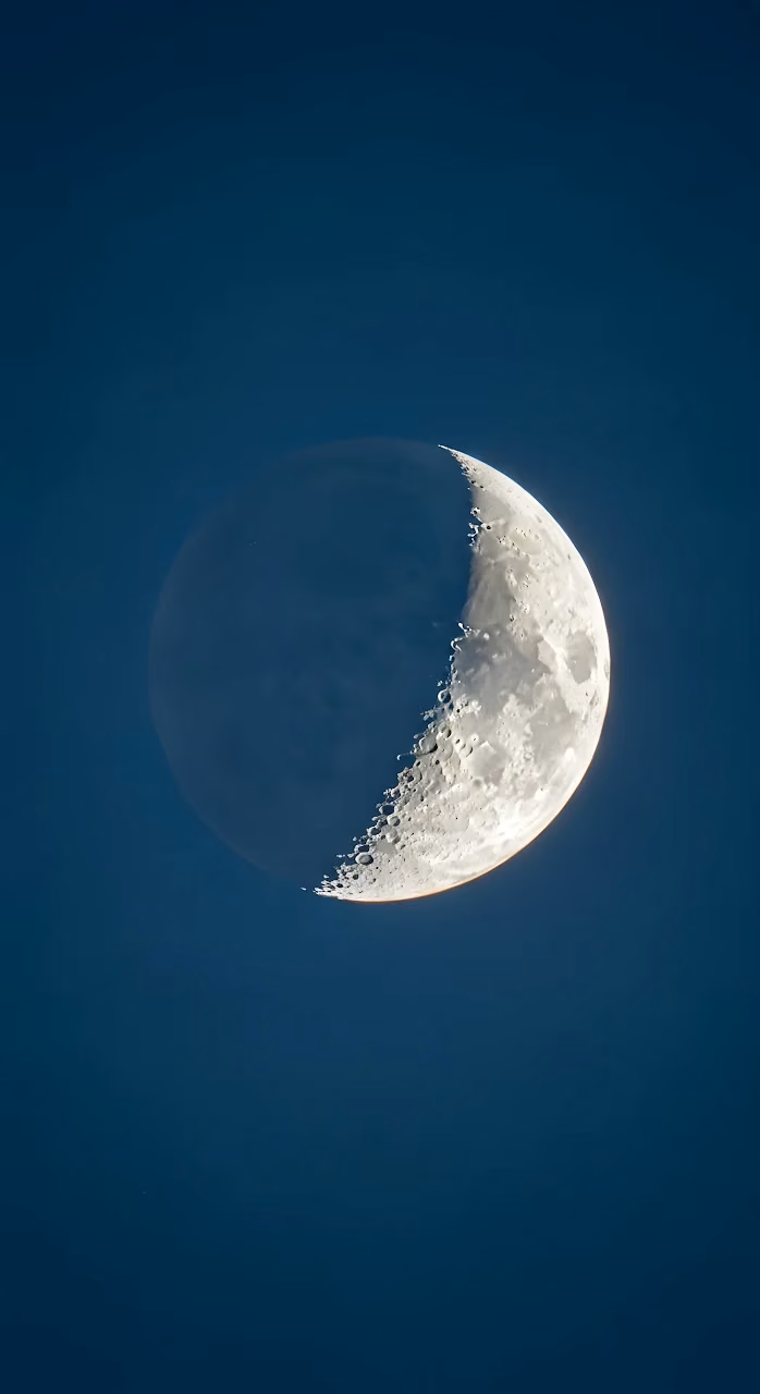 Detailed First Quarter Moon Against Deep Blue Sky - Free Mobile AMOLED Wallpaper Background