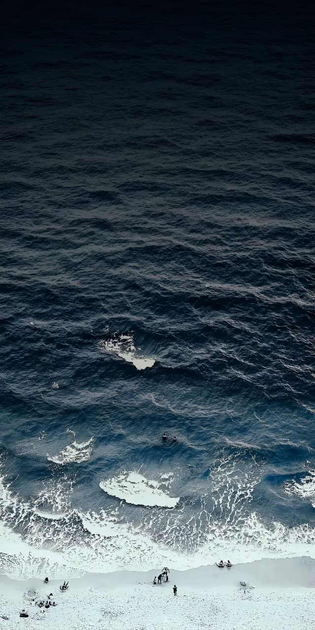 Dramatic Aerial View of Dark Blue Ocean Meeting White Sand - Free Mobile AMOLED Wallpaper Background