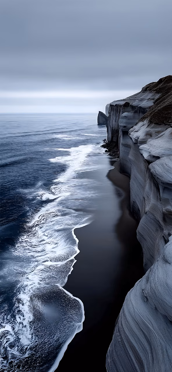 Download Dramatic Monochromatic Cliffs Over Dark Volcanic Beach Wallpaper in Mobile HD Dramatic Monochromatic Cliffs Over Dark Volcanic Beach - Free Mobile AMOLED Wallpaper Background