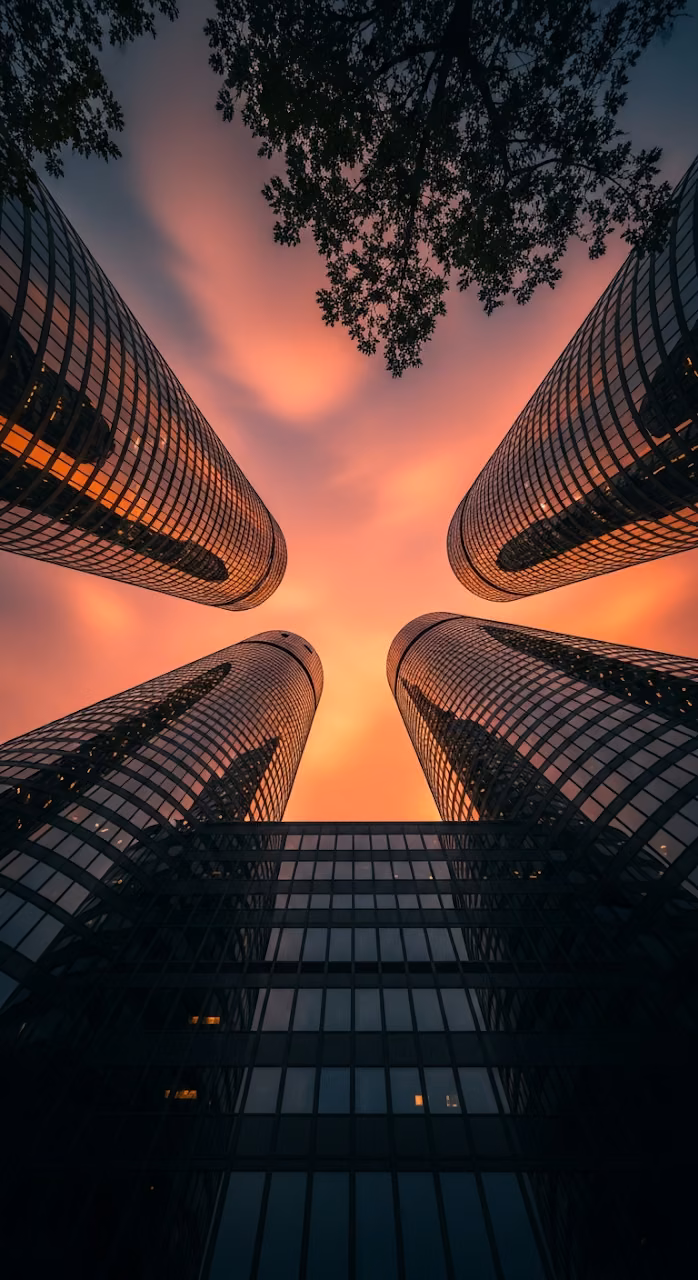 Dramatic Worm's Eye View of Modern City Skyscrapers at Sunset - Free Mobile AMOLED Wallpaper Background