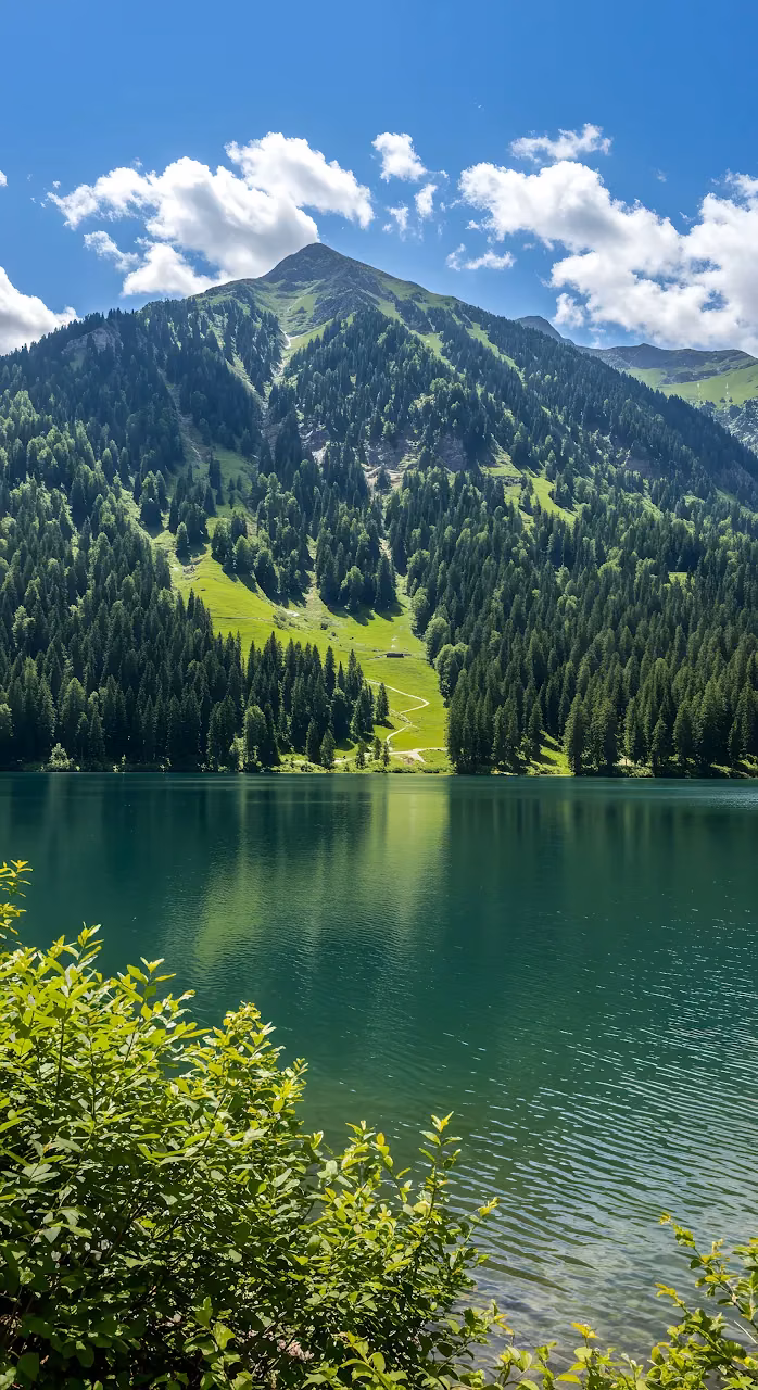 Emerald Mountain Lake Beneath Towering Alpine Peak - Free 4K Desktop Wallpaper Background
