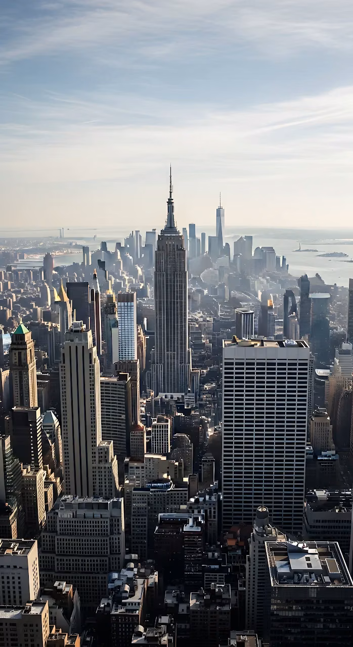 Empire State Building Towering Over Midtown Manhattan Day - Free Mobile AMOLED Wallpaper Background