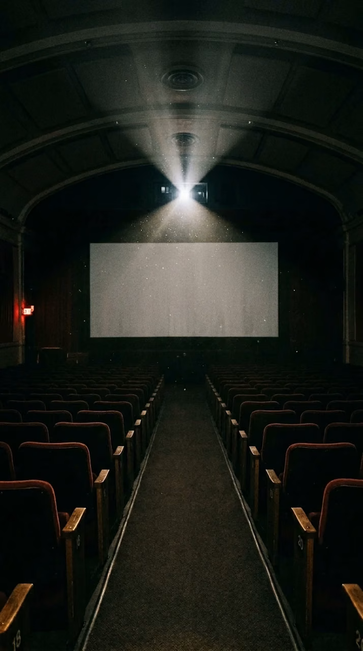 Empty Movie Theater with Projector Light and Floating Dust - Free Mobile AMOLED Wallpaper Background