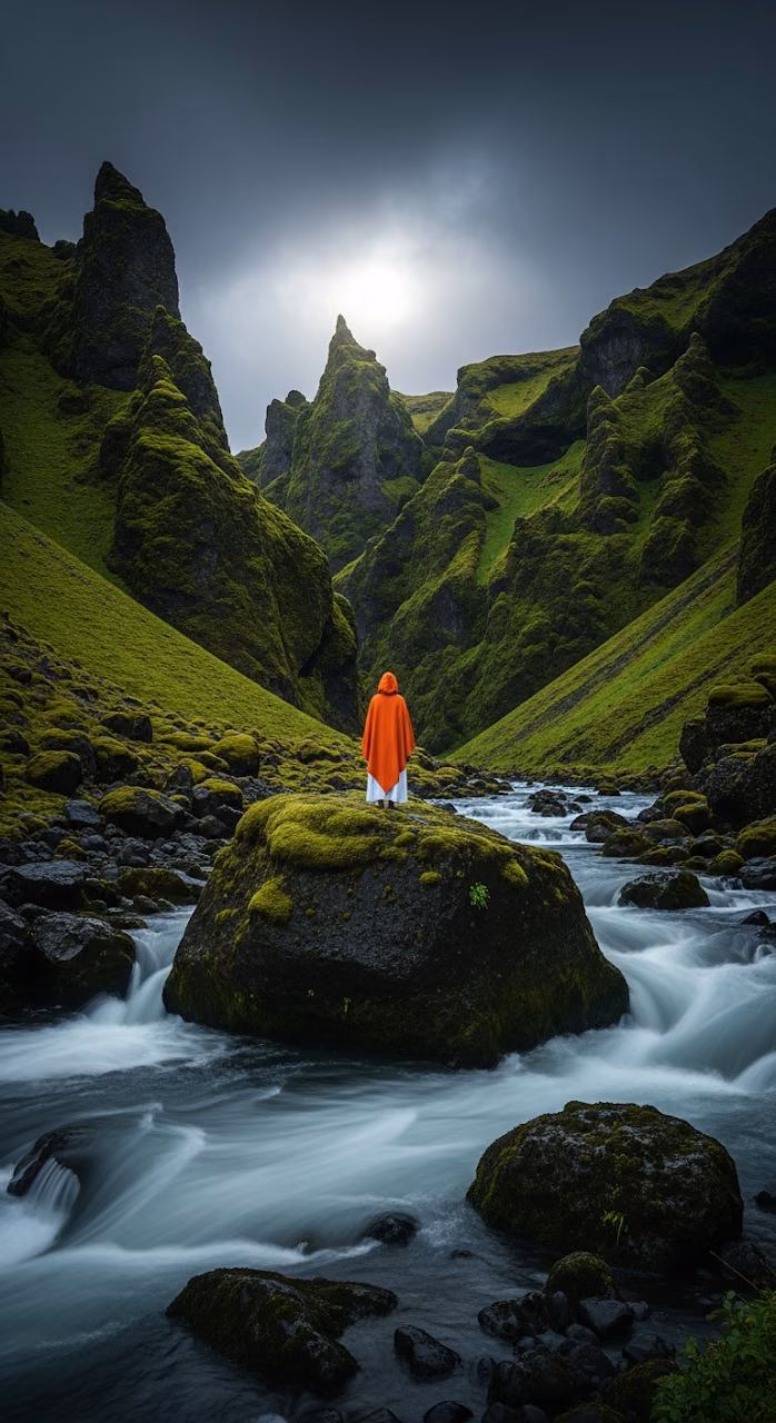 Download Epic and Turbulent Landscape of a Person in an Orange Cloak Standing on a Rock in a Fast-Flowing River Gorge Wallpaper in Mobile HD Epic and Turbulent Landscape of a Person in an Orange Cloak Standing on a Rock in a Fast-Flowing River Gorge - Free Mobile AMOLED Wallpaper Background