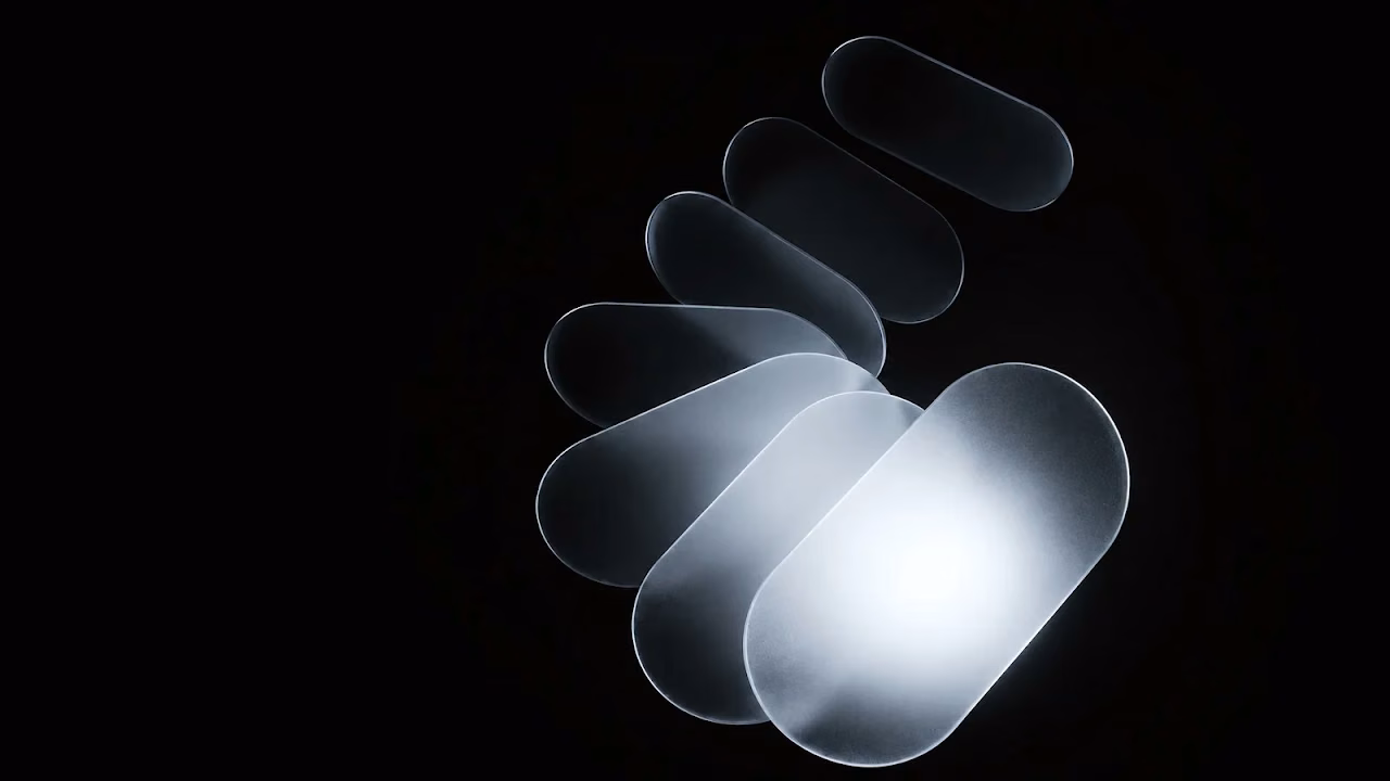 Download Frosted Glass Spiral Minimalist Dark 4K Wallpaper in 4K UHD Overlapping frosted translucent glass oval shapes arranged in a spiral curve glowing softly on a black background.