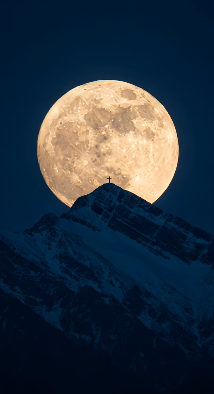 Download Giant Full Moon Setting Behind a Snowy Mountain Peak and Summit Cross Silhouette Wallpaper in Mobile HD Giant Full Moon Setting Behind a Snowy Mountain Peak and Summit Cross Silhouette - Free Mobile AMOLED Wallpaper Background