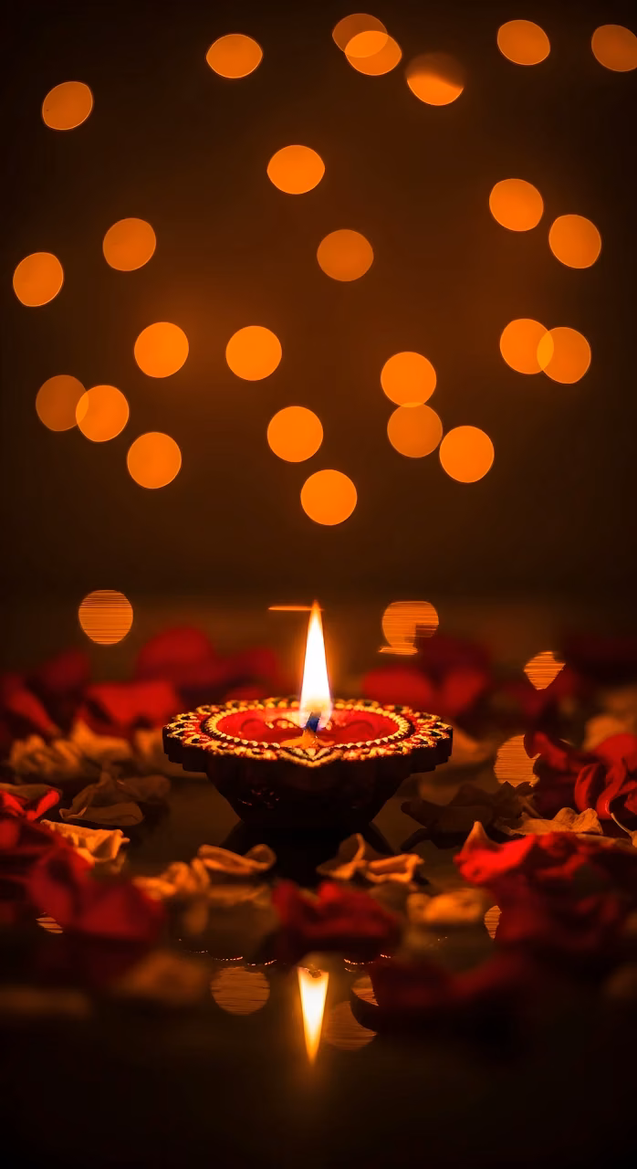 Glowing Diya Lamp Bokeh Lights and Rose Petals Diwali Scene - Free Mobile AMOLED Wallpaper Background