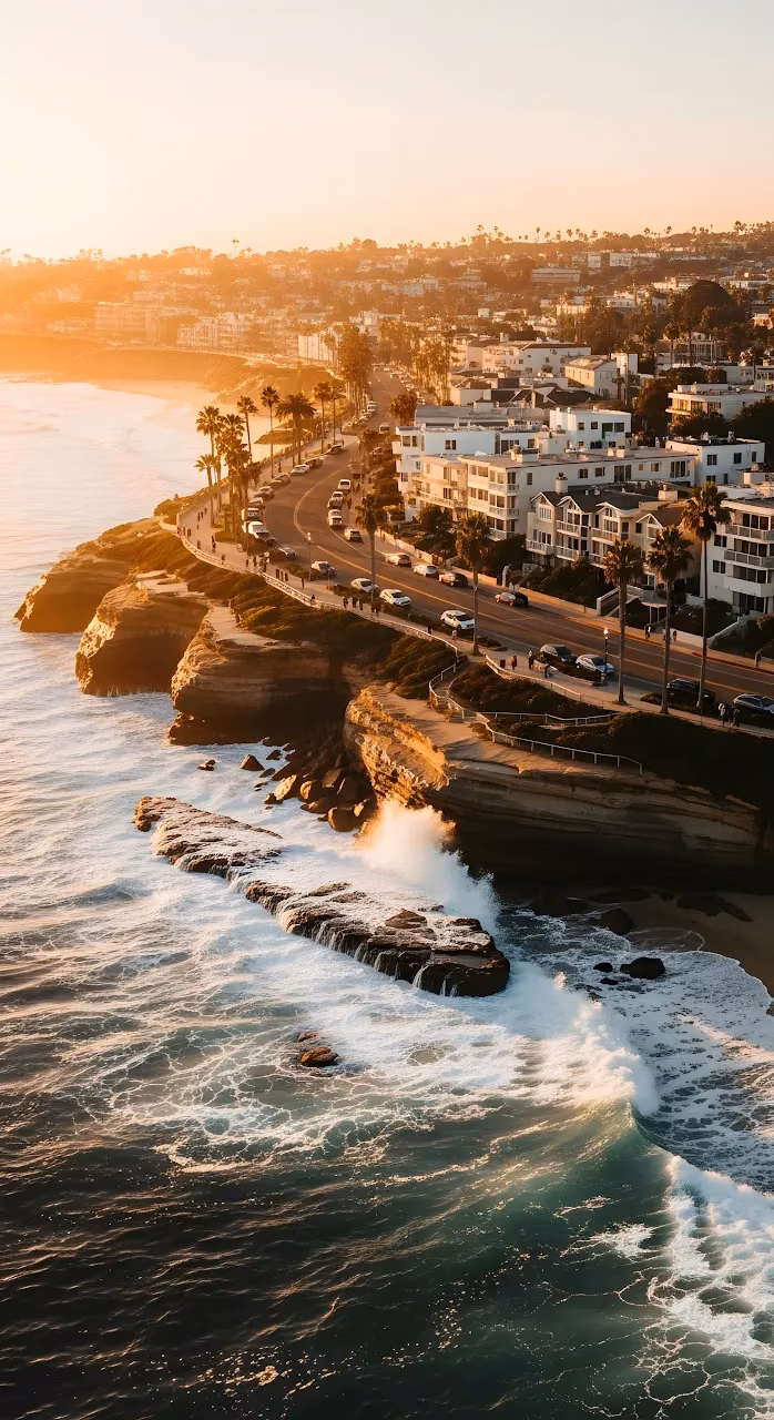 Golden Sunset Over La Jolla Coastline Cliffs and Crashing Waves - Free Mobile AMOLED Wallpaper Background