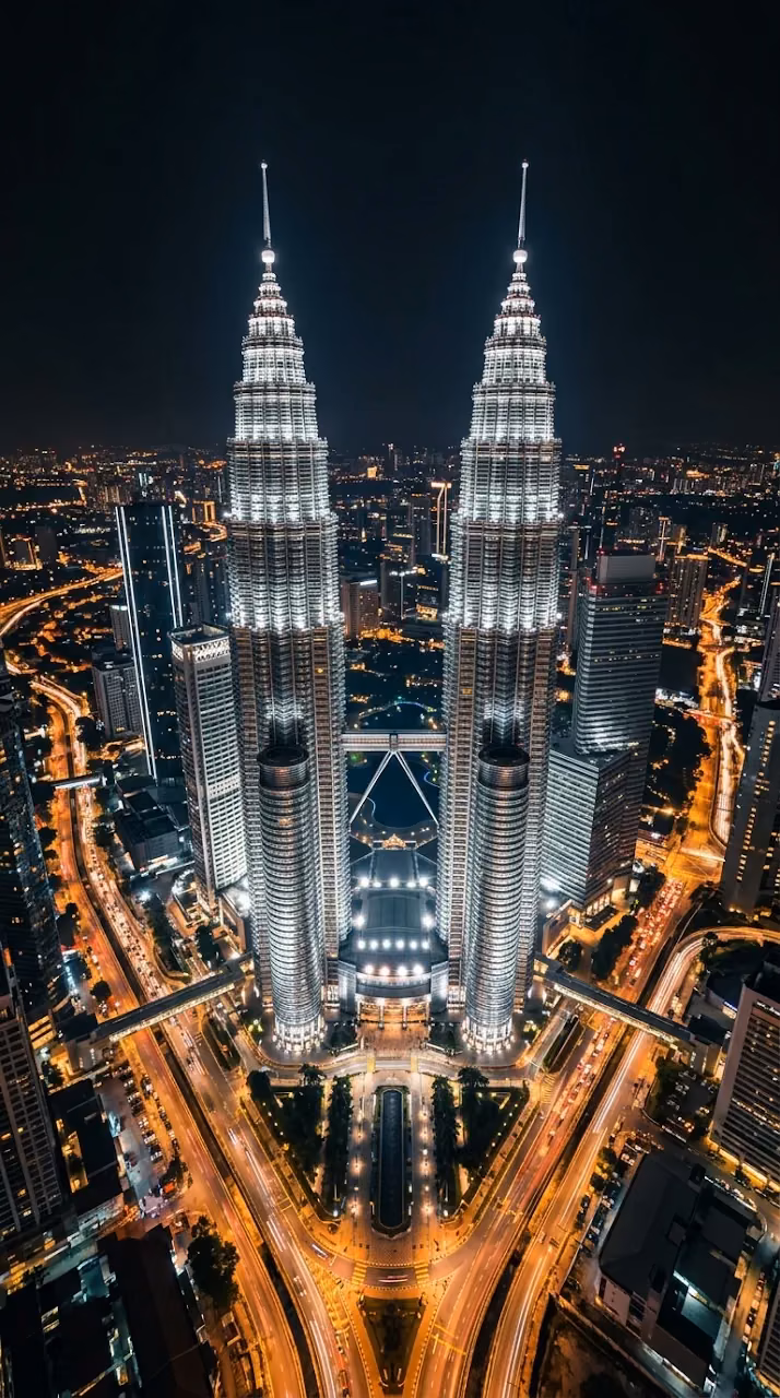 Download High-Angle Aerial Night View of the Petronas Twin Towers Wallpaper in Mobile HD High-Angle Aerial Night View of the Petronas Twin Towers - Free Mobile AMOLED Wallpaper Background