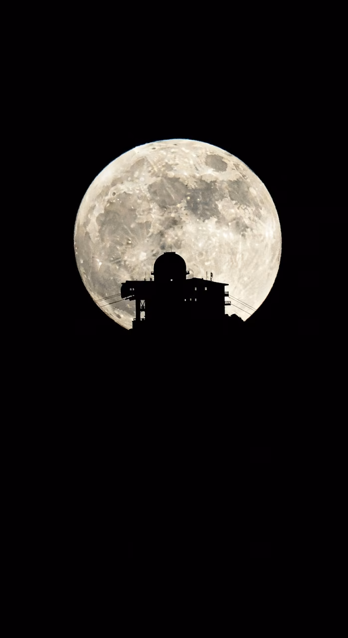Download High-Contrast Silhouette of Alpine Summit Structure Against a Giant Full Moon Wallpaper in Mobile HD High-Contrast Silhouette of Alpine Summit Structure Against a Giant Full Moon - Free Mobile AMOLED Wallpaper Background