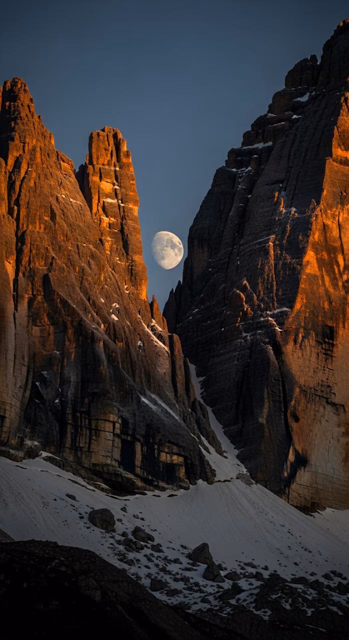 Download Jagged Rocky Mountain Peaks with Alpenglow and Obscured Moon Wallpaper in Mobile HD Jagged Rocky Mountain Peaks with Alpenglow and Obscured Moon - Free Mobile AMOLED Wallpaper Background