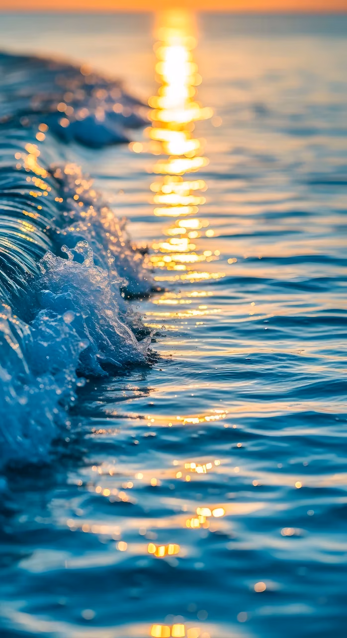 Ocean Wave Cresting Golden Sunset Water Spray - Free Mobile AMOLED Wallpaper Background