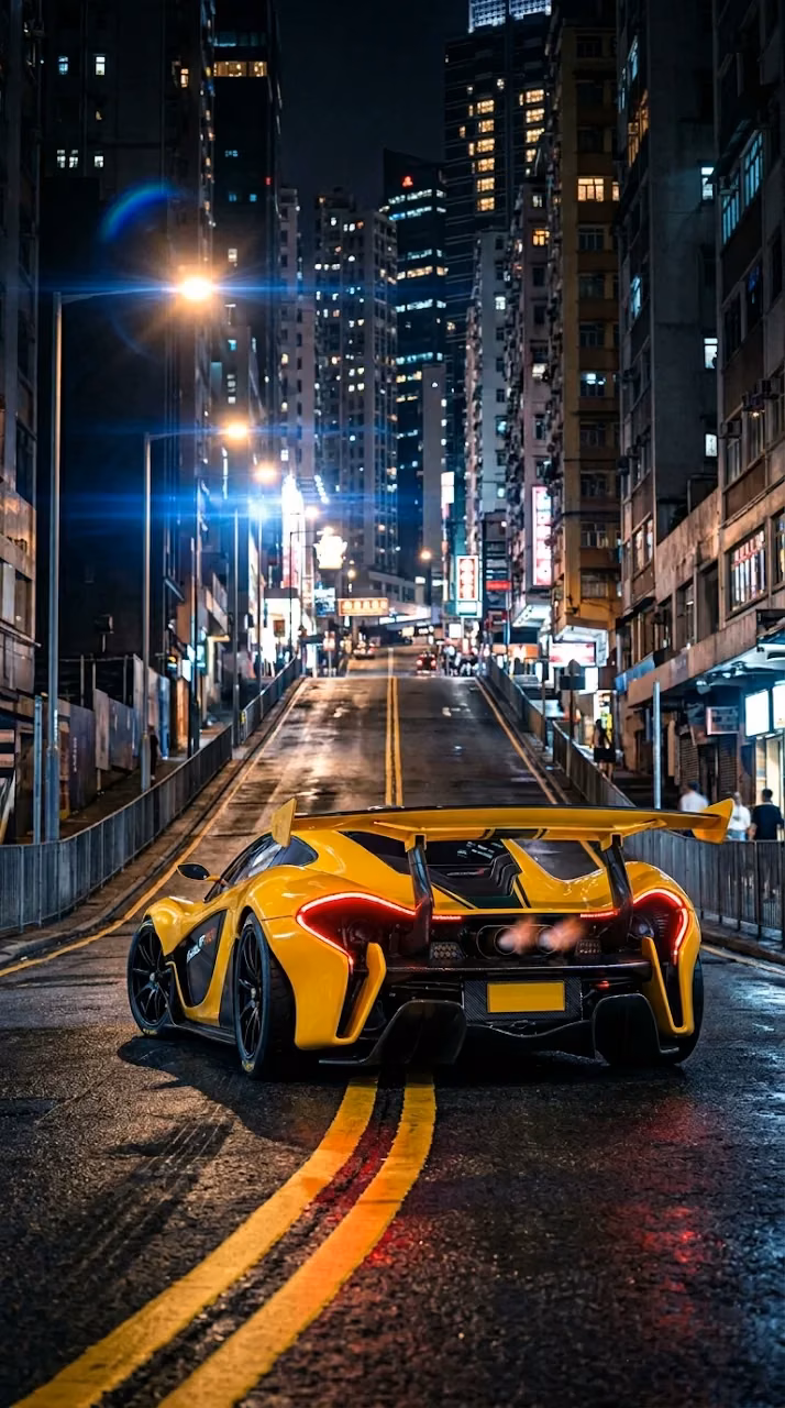 Download Rear View of a Yellow Supercar on a Steep City Street at Night Wallpaper in Mobile HD Rear View of a Yellow Supercar on a Steep City Street at Night - Free Mobile AMOLED Wallpaper Background