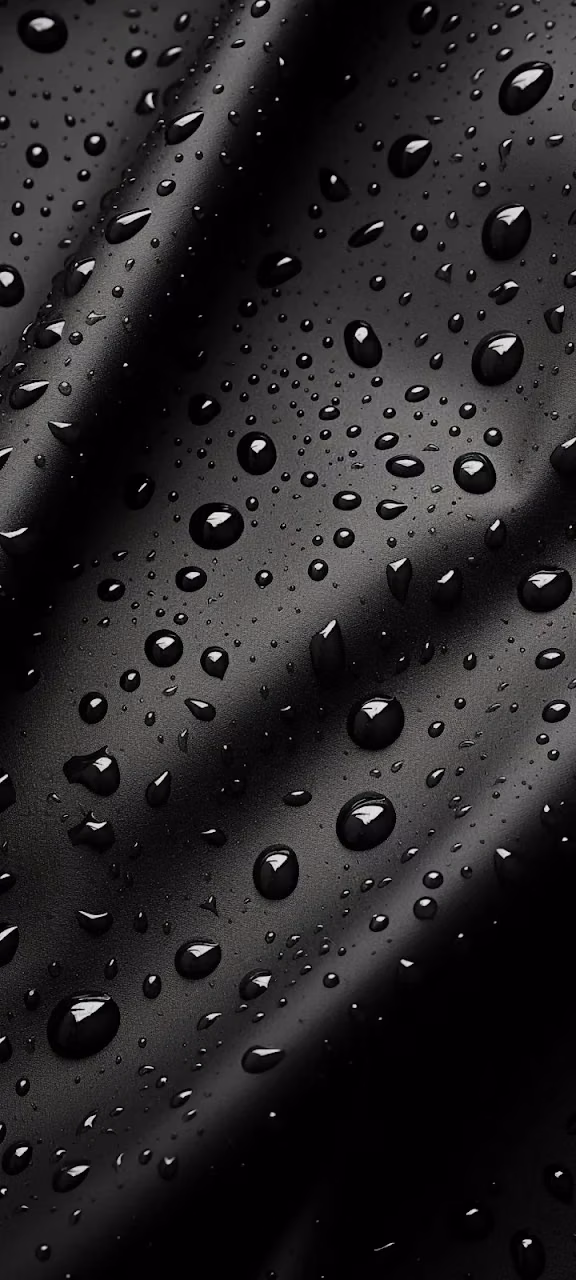 Reflective Water Droplets on Dark Black Textured Surface - Free 4K Desktop Wallpaper Background
