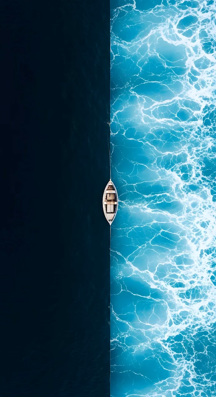 Rowboat on Split Contrast Ocean Water Aerial View - Free Mobile AMOLED Wallpaper Background