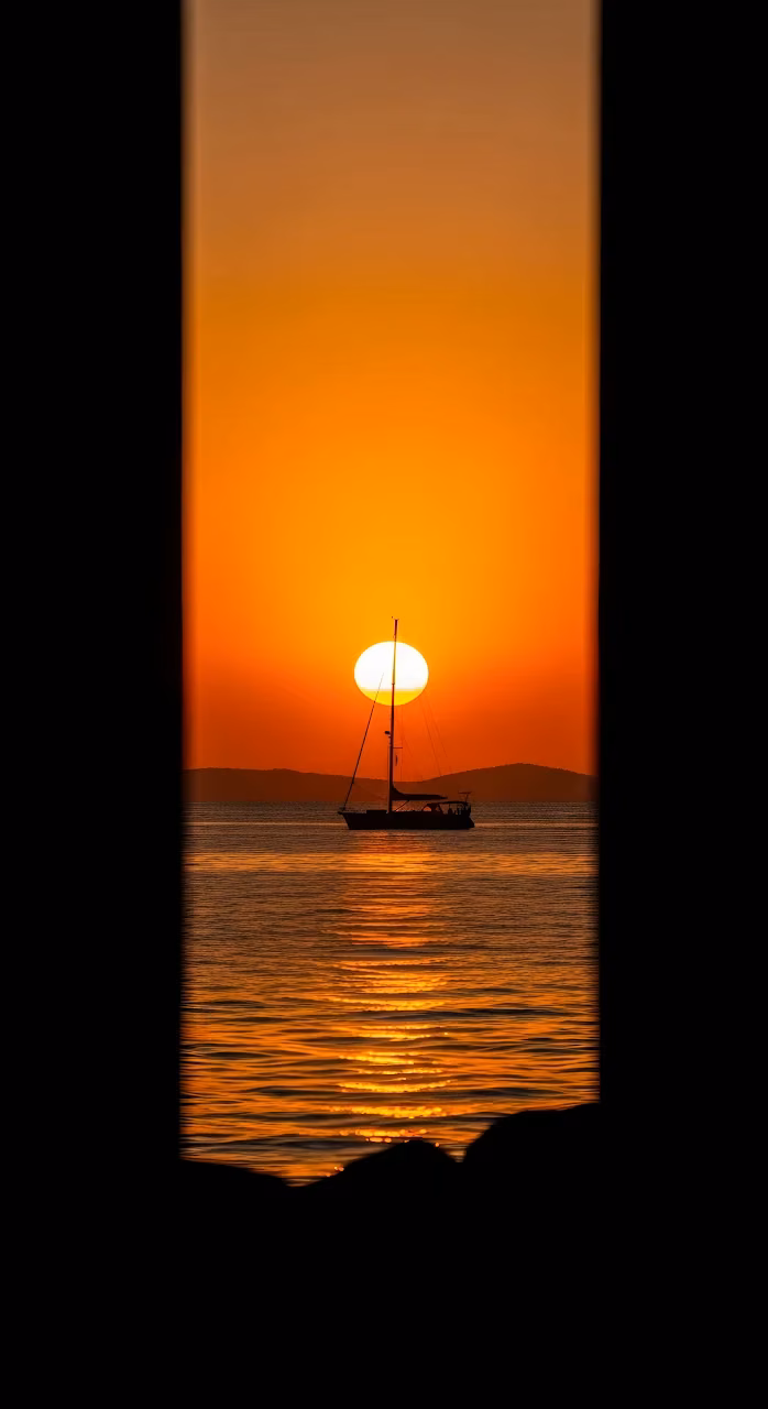 Download Sailboat Silhouette Framed by Black Bars at Sunset Wallpaper in Mobile HD Sailboat Silhouette Framed by Black Bars at Sunset - Free Mobile AMOLED Wallpaper Background