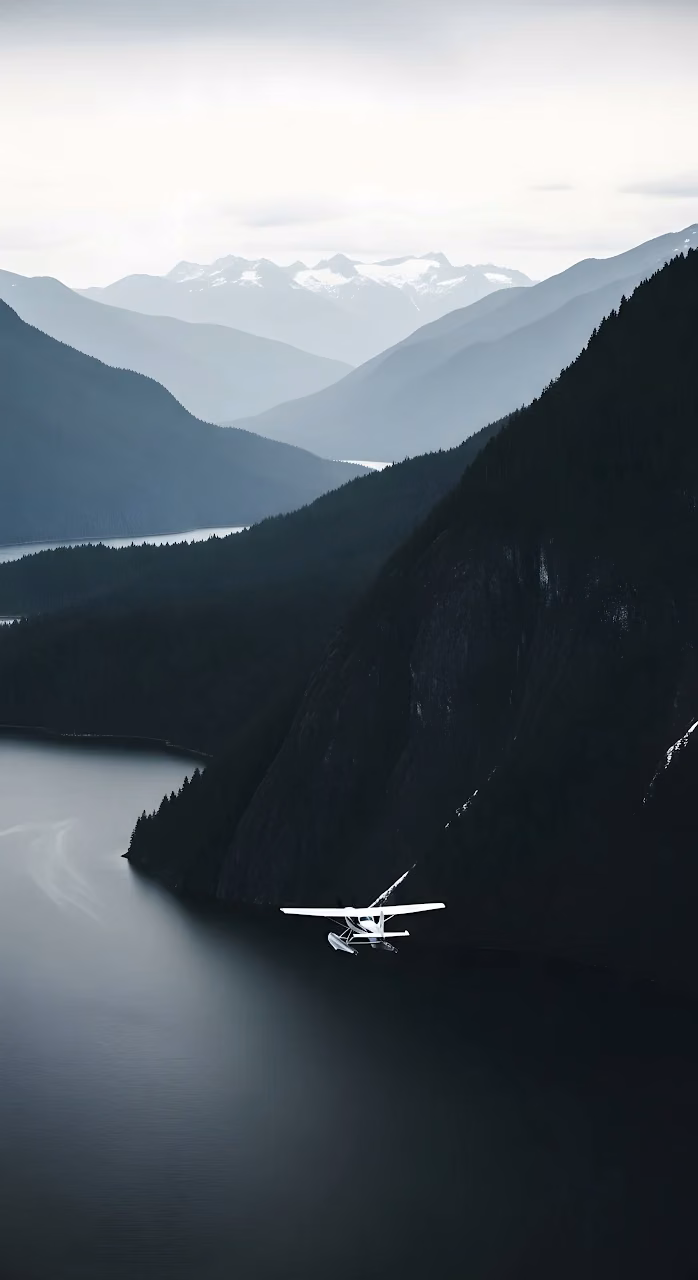 Seaplane Flying Low Over Dark Fjord Mountain Valley - Free Mobile AMOLED Wallpaper Background