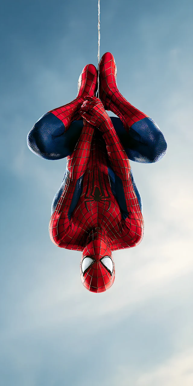 Download Spider-Man Hanging Upside Down Sky HD Wallpaper in Mobile HD Spider-Man hanging upside down on a web line against a clear blue sky wearing a red and blue textured suit.