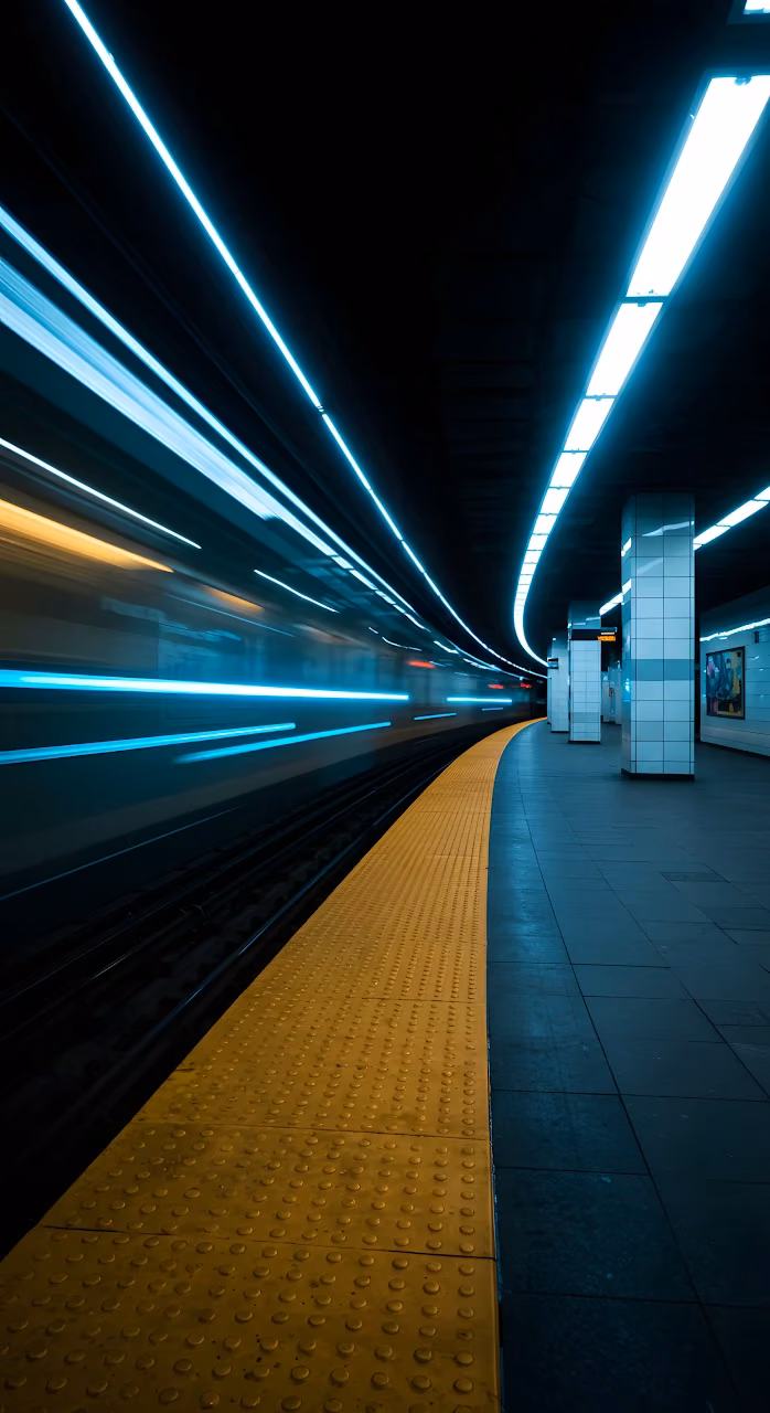 Subway Train Speeding Through Station with Blue Light Trails - Free Mobile AMOLED Wallpaper Background