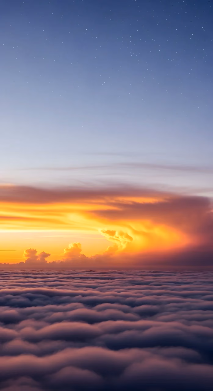 Towering Cumulus Clouds at Dusk Over a Distant City - Free Mobile AMOLED Wallpaper Background