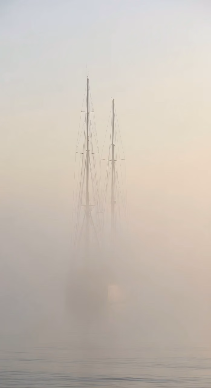 Two Sailboat Masts Emerging from Ethereal Morning Fog - Free Mobile AMOLED Wallpaper Background