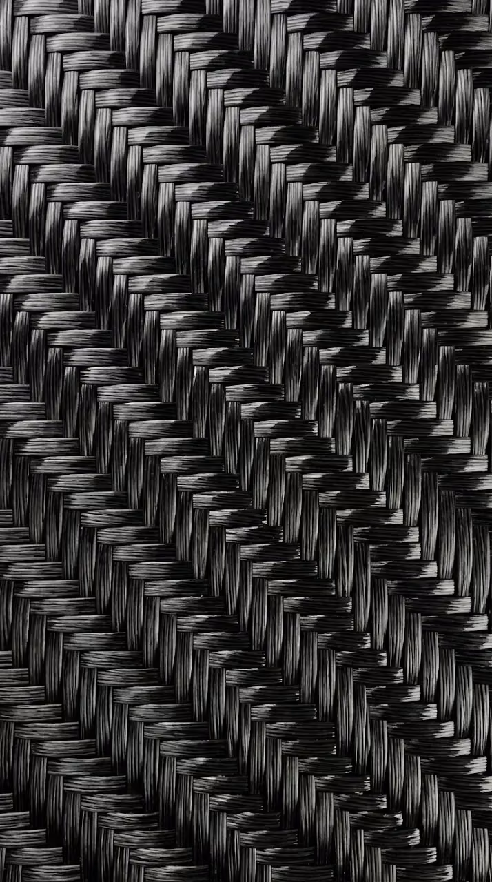 Ultra-Realistic Carbon Fiber Weave with Glossy Finish - Free Mobile AMOLED Wallpaper Background