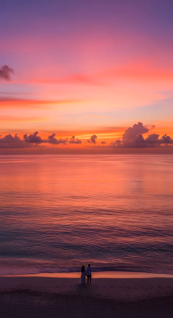Vibrant Tropical Sunset Over Ocean with Couple - Free Mobile AMOLED Wallpaper Background