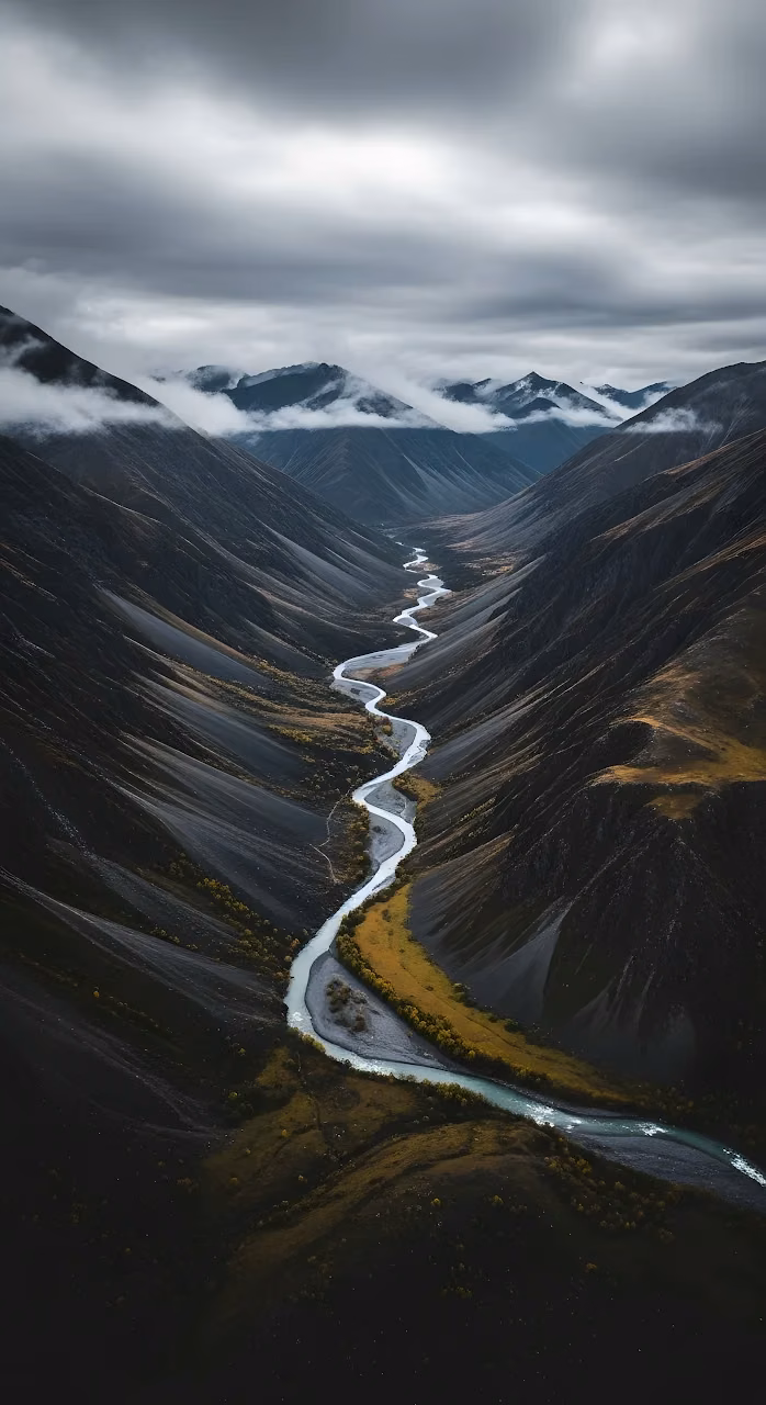 Winding River Through Dark Mountain Valley, Moody Sky - Free Mobile AMOLED Wallpaper Background
