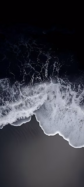 Aerial View of White Ocean Foam on Dark Black Sand Beach - Free 4K & 8K Mobile Wallpaper