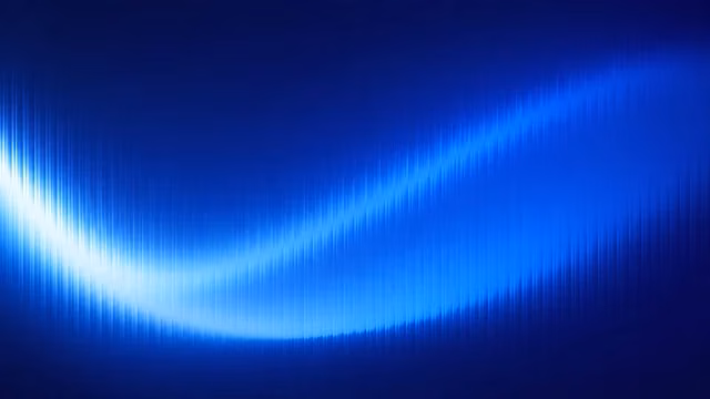A glowing blue frequency wave curves smoothly across a dark blue gradient field. Bright cyan and royal blue curved sound wave pattern against a dark navy gradient background.