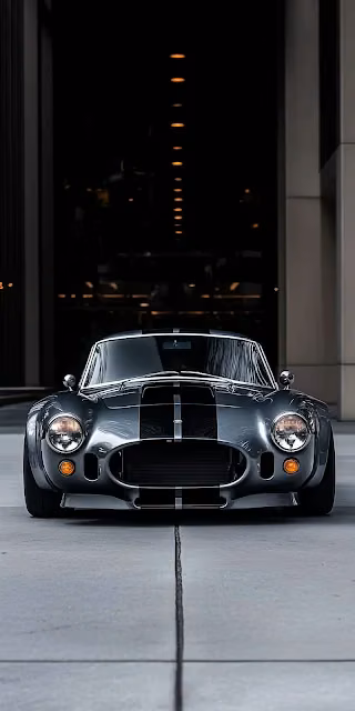 Classic Shelby Cobra Sports Car in Urban Garage Setting - Free 4K & 8K Mobile Wallpaper