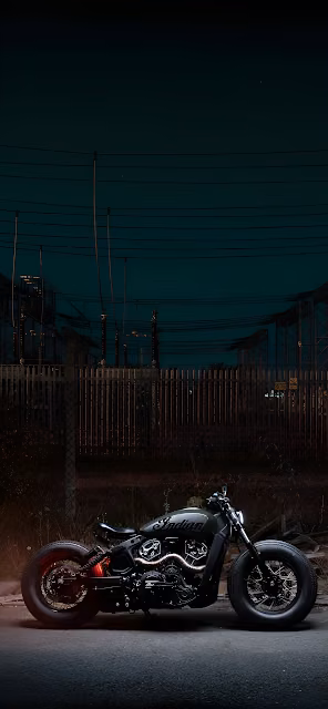 Custom Indian Motorcycle Parked at Night Industrial Setting - Free 4K & 8K Mobile Wallpaper