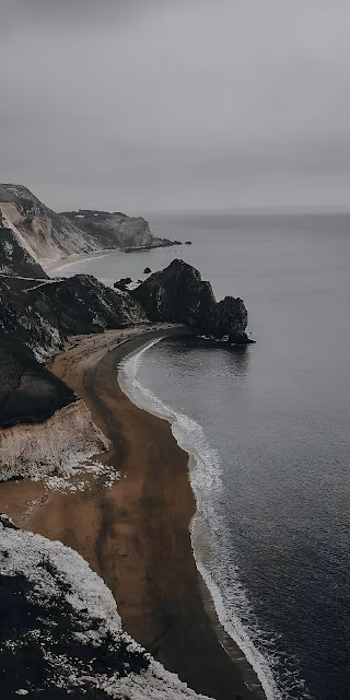 Dramatic Coastal Cliffs Overcast Beach Landscape View - Free 4K & 8K Mobile Wallpaper