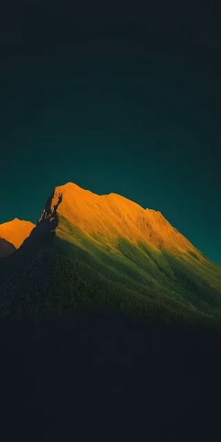 Golden Hour Light on a Minimalist Forest Mountain Peak - Free 4K & 8K Mobile Wallpaper