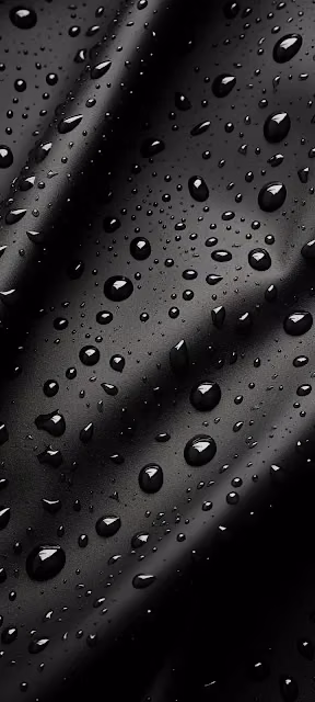 Reflective Water Droplets on Dark Black Textured Surface - Free 4K & 8K Mobile Wallpaper