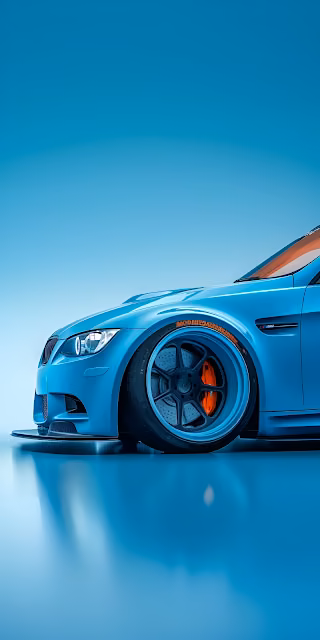 Sleek Blue Sports Car with Orange Brake Calipers on Gradient - Free 4K & 8K Mobile Wallpaper