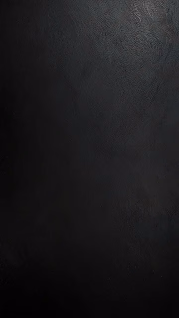 Textured Black Surface with Subtle Grain - Free 4K & 8K Mobile Wallpaper