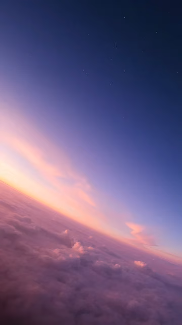 Twilight Horizon Above Pink Clouds and Distant Stars - Free 4K & 8K Mobile Wallpaper