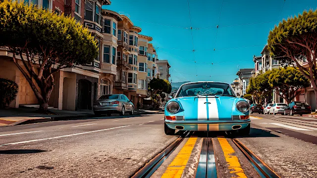 Classic light blue sports car positioned on streetcar tracks along a San Francisco neighborhood street. Classic light blue sports coupe with white racing stripes centered on streetcar tracks in a city street.